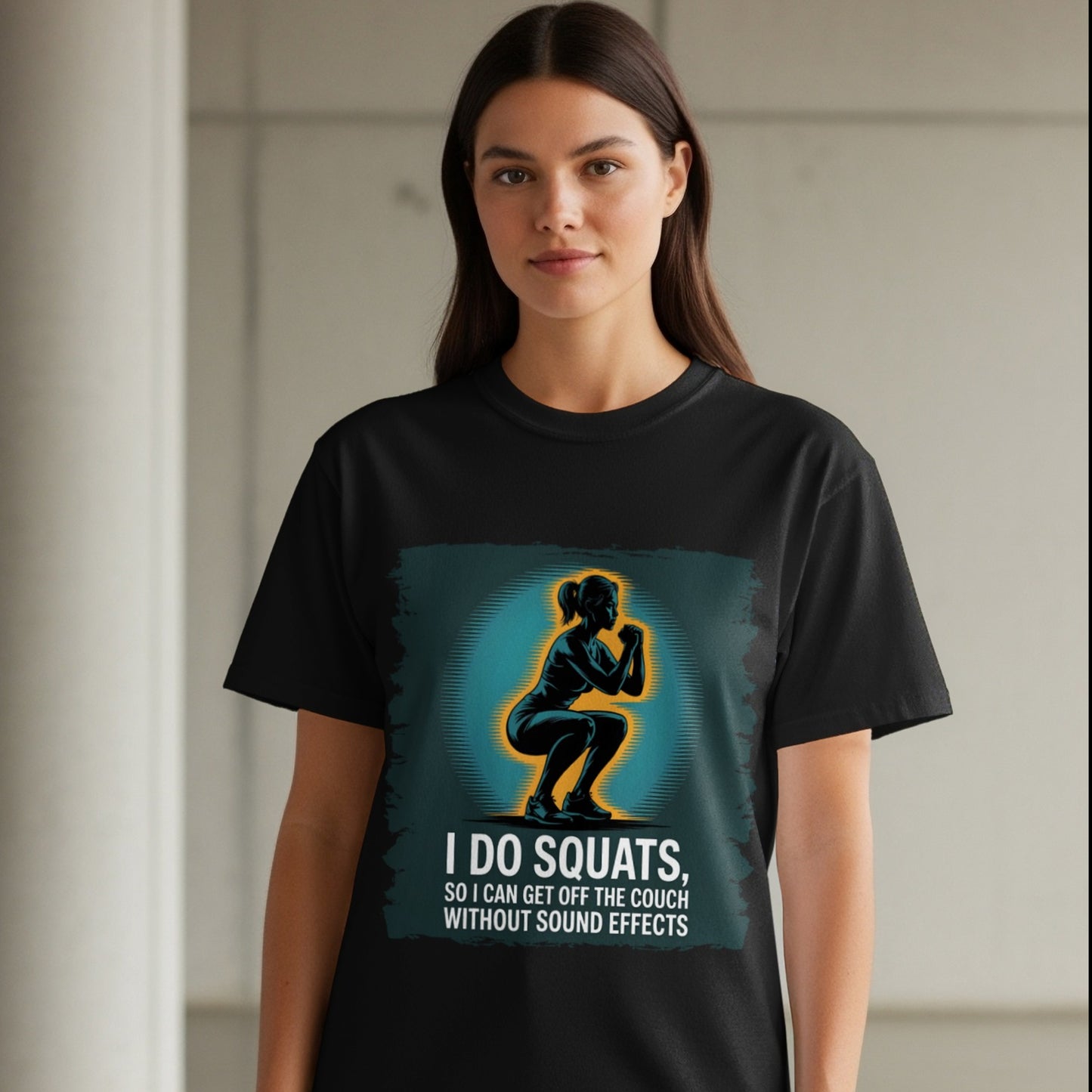 Funny squat workout shirt on black tee, woman standing in indoor gym-style space