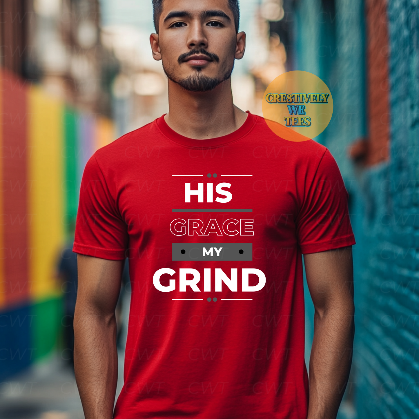 Stylish man in a red T-shirt with the words “His Grace My Grind,” showcasing motivation and faith-driven ambition.