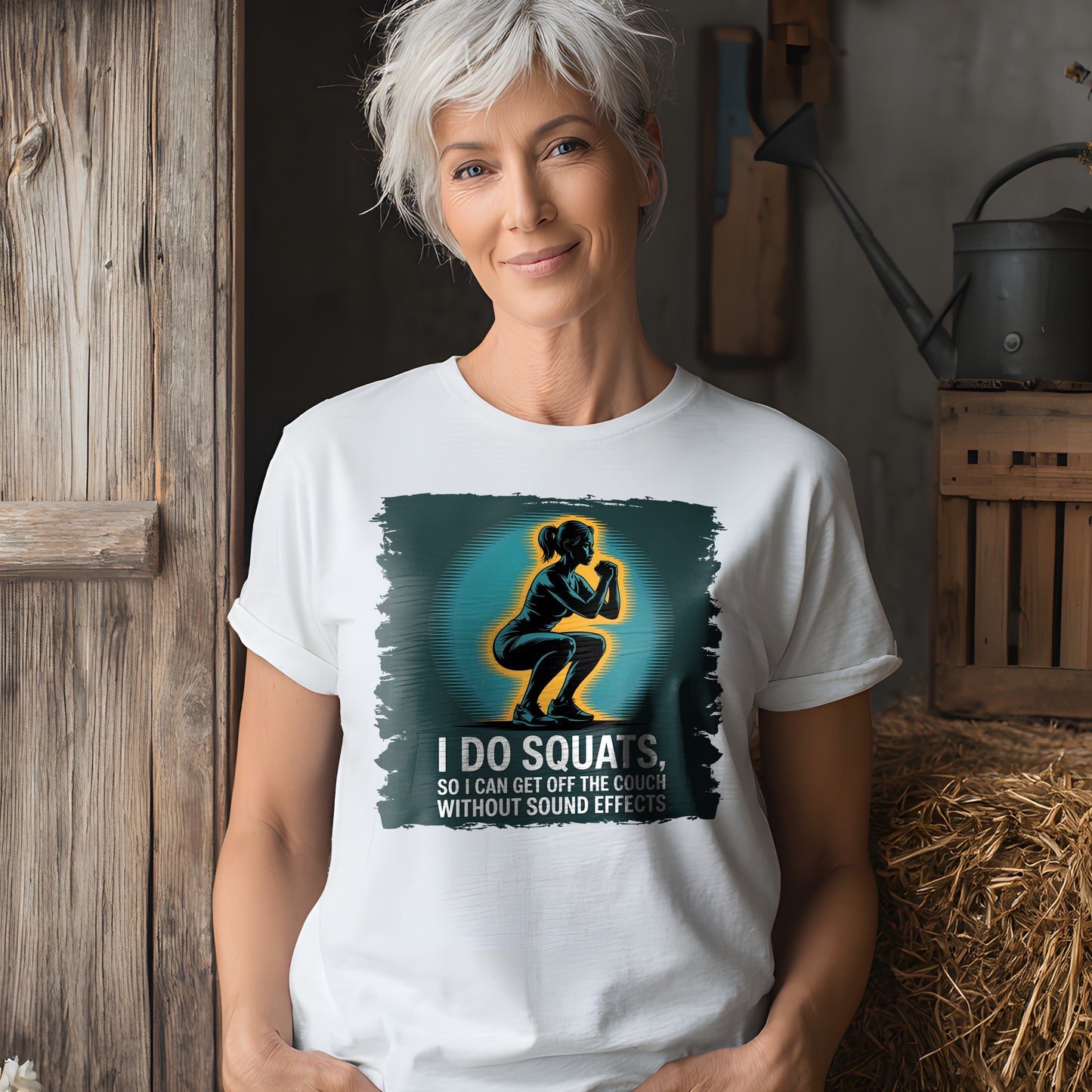 Mature woman in white t-shirt with humorous squat quote, rustic background setting