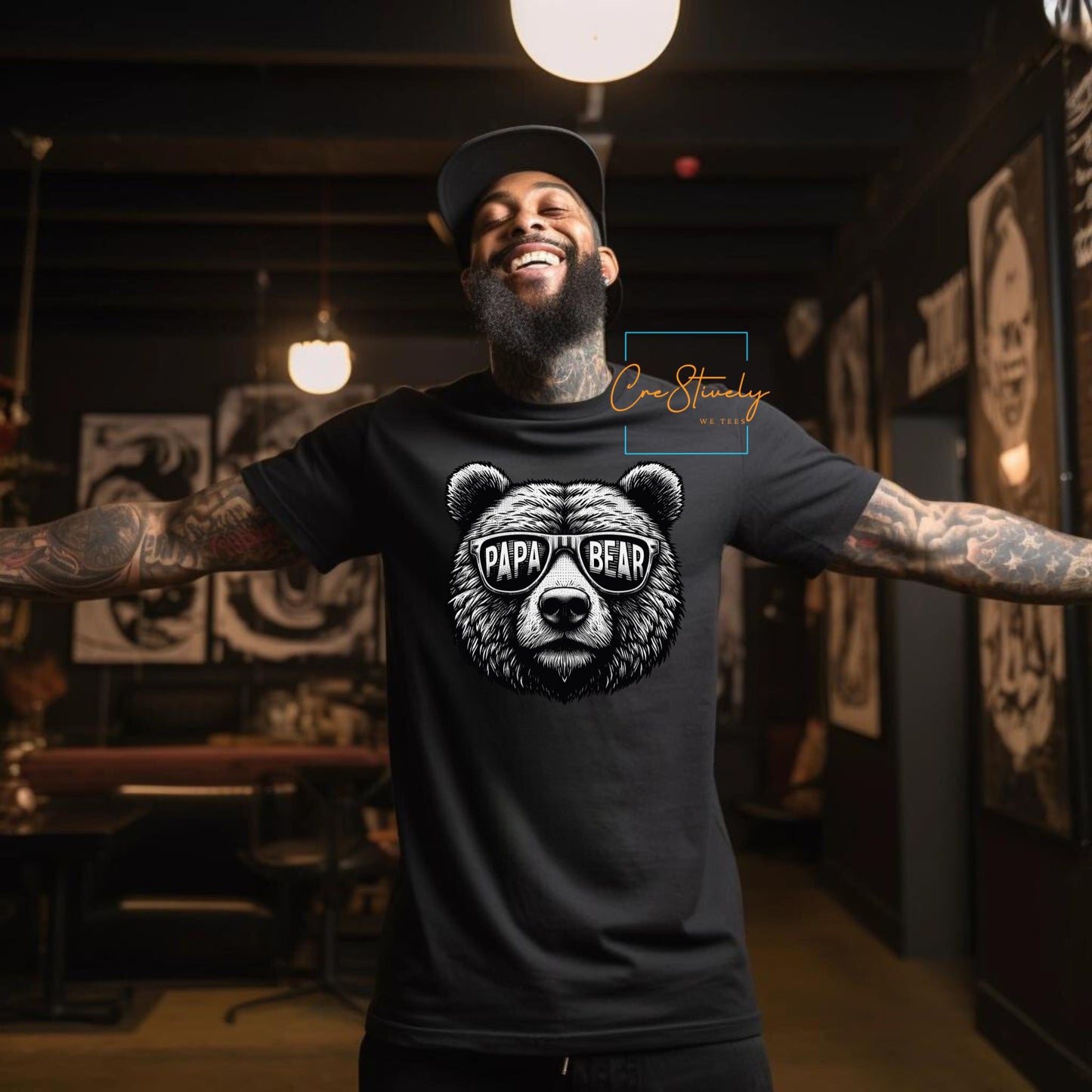 Man smiling and wearing a black t-shirt with a detailed Papa Bear design in sunglasses.
