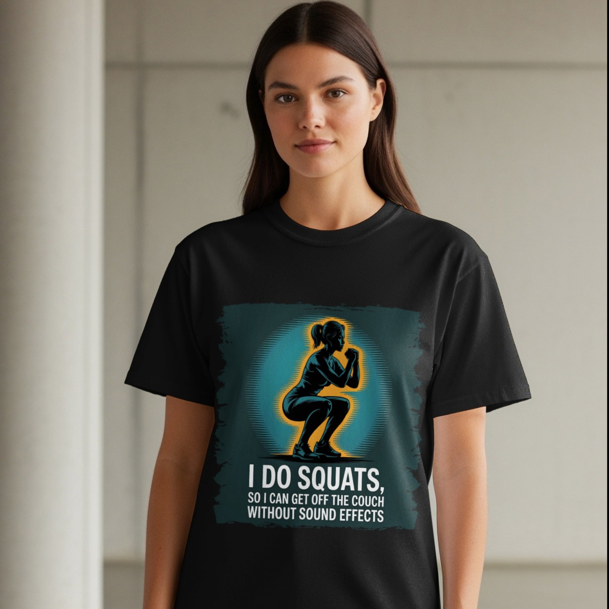 Funny squat workout shirt on black tee, woman standing in indoor gym-style space