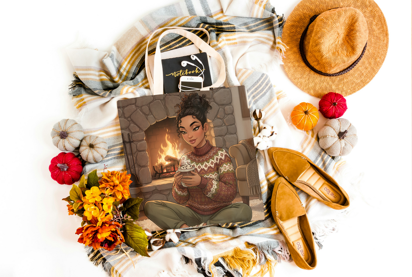 photo of tote bag with digital illustration of african american woman n comfy sweater and leggings in front of a fire, holding a cup of cocoa